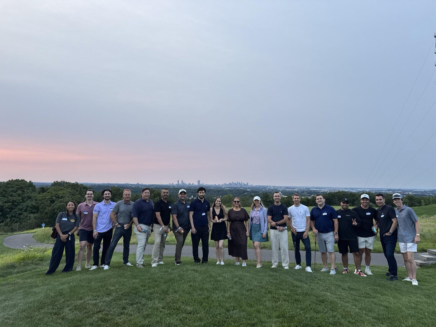 The full group lined up on the course at sunset
