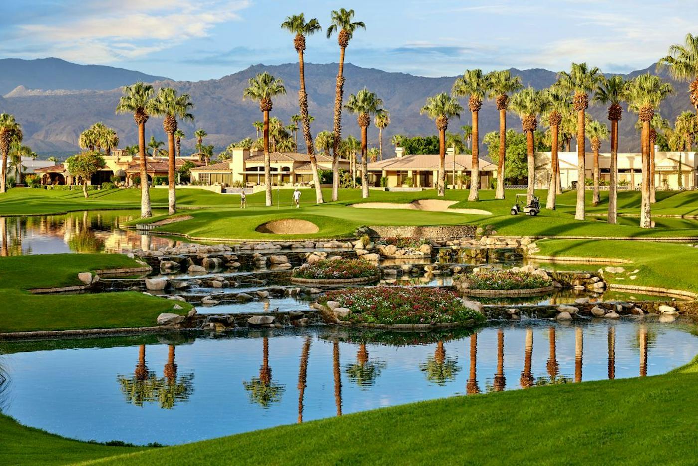 Palm trees, waterfalls and a green on the Palm Course at JW Marriott Desert Springs