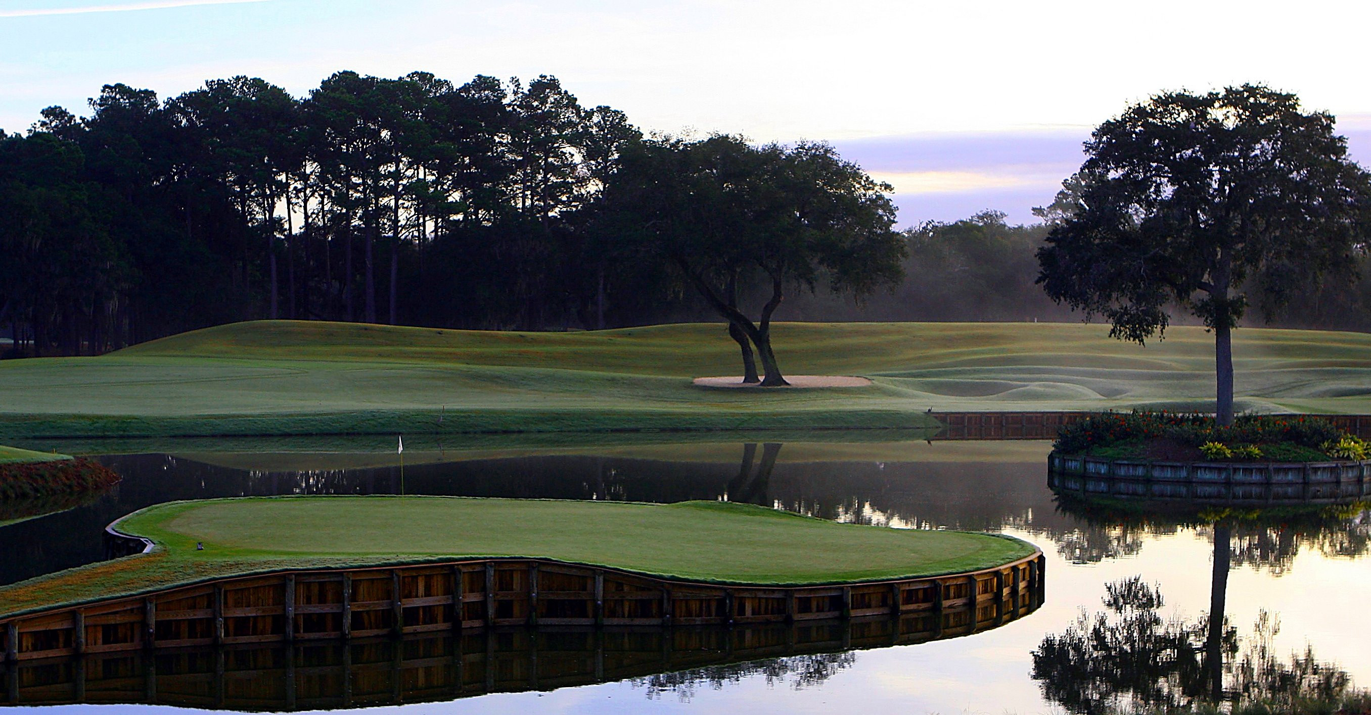 The island green on the 17th hole at TPC Sawgrass at sunset